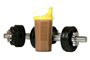 8898761 - protein shake in plastic shaker, with weights, isolated on white