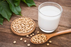 31138259 - soy milk and soy bean on wooden background